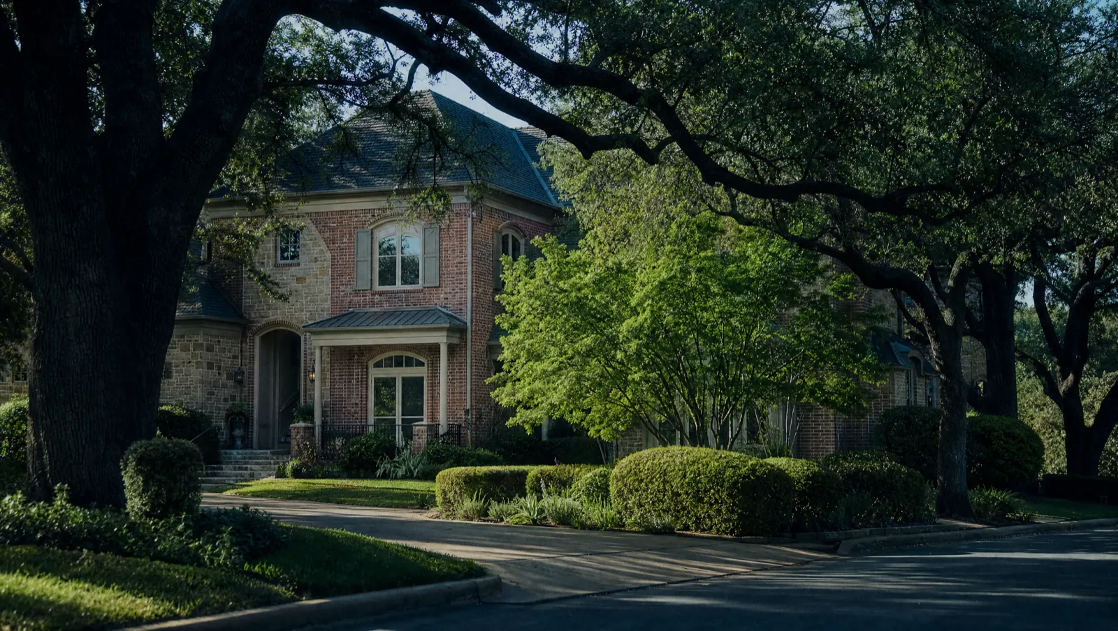 Established homes set back behind mature oaks in Woodway, TX 76712, near Bosque Boulevard